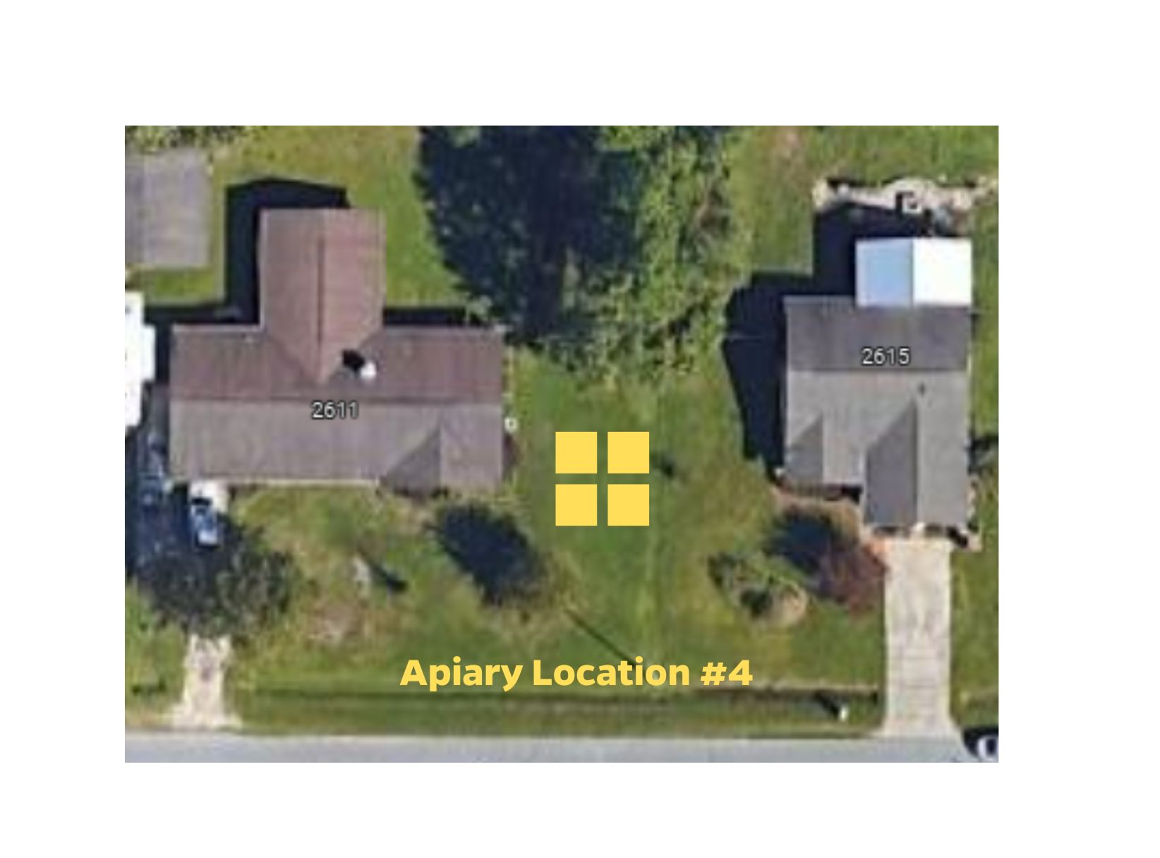 Aerial map view of Apiary Location #4, which is on plain grassy land between two houses.